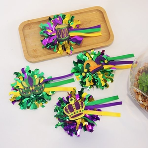 Set of four Mardi Gras festive hair clips with purple green and gold glitter crown masks
