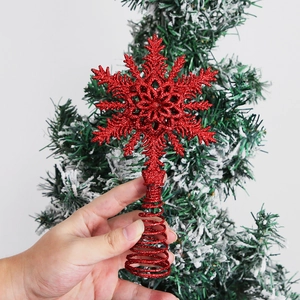 Red glitter snowflake Christmas tree topper with spiral spring base for holiday decoration