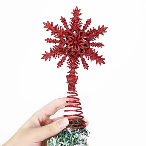Sparkling red snowflake Christmas tree topper with glitter finish and spring base