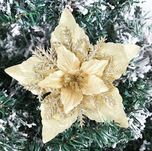 Detailed macro view of 16cm gold glitter fabric poinsettia with multi-layered petals