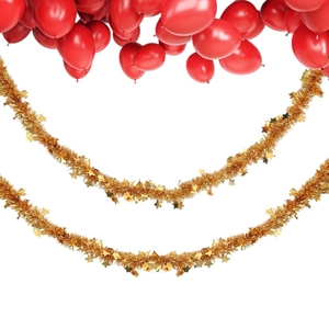 Golden Christmas tinsel garland with stars and red balloons for festive party decoration