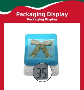 Mini green Christmas ribbon bow with holiday patterns and packaging weight of 3.5g
