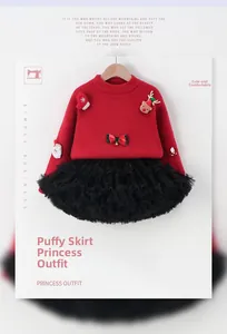 Detail of red Christmas knit sweater with Santa elk patches and black tulle tutu skirt