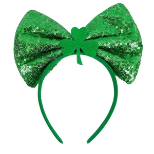 St. Patrick's Day headband with large green sequin bow and shamrock party ornament