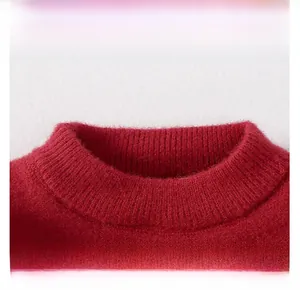 Close-up of the red knitted festive sweater neckline with premium ribbed texture