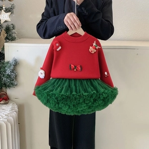 Detailed view of girls' Christmas sweater set with 3D cartoon patches and green tutu skirt