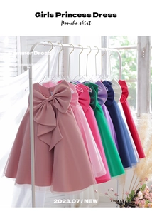 Detail of elegant girls' satin and organza princess dress with large bow accent
