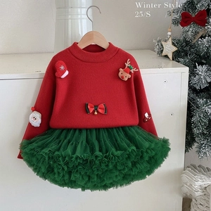 Detail of red Christmas knit sweater and green tulle tutu skirt set for toddler girls