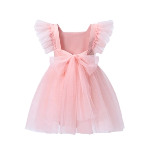 Detailed back view of pink baby tulle dress featuring a large satin bow and ruffled sleeves