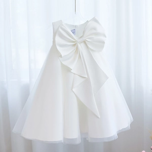 Elegant white sleeveless princess ball gown for girls with a large bow and tulle skirt