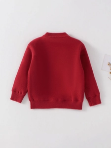 Red festive knit sweater for girls with ribbed cuffs and cozy winter thick fabric