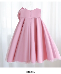 Detail of pink girls' princess dress featuring smooth satin fabric and a back zipper
