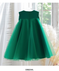 Detail of emerald green flower girl dress showing invisible back zipper and satin bodice