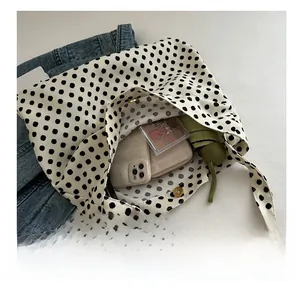 Polka dot canvas tote bag showing spacious interior for smartphone, wallet, and umbrella