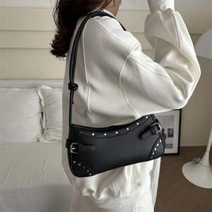 Vintage black underarm bag with silver studs and metal buckle detail in moon shape