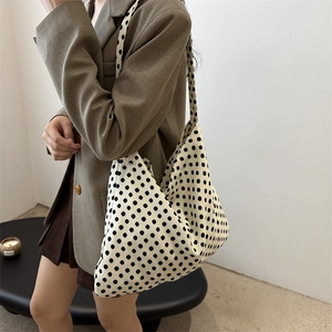 Chic black and white polka dot canvas tote bag with large capacity for commuting