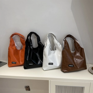 Minimalist oil wax leather tote bags for women in four vibrant colors with fashion label