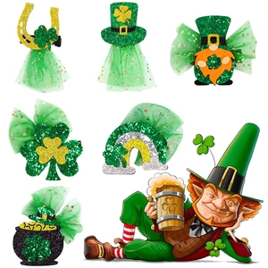 Detail of St. Patrick's Day hair clips with green shamrocks, gold coins and tulle accents