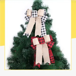 Close-up of red and black buffalo plaid Christmas tree bows with natural burlap layers