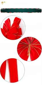 Macro details of red flocked Christmas bow with gold trim and back twist tie