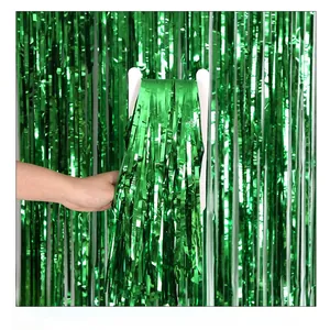 Close-up of shiny green metallic foil fringe curtain for party wall decoration