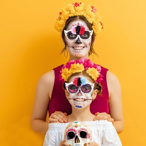 Detail of Day of the Dead flower headbands and skull masks for festive costumes