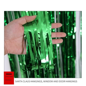 Close-up of metallic green fringe curtain showing shiny reflective texture for party decor