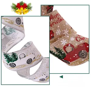 Detail of Christmas ribbons with red truck and snowy tree prints on linen fabric