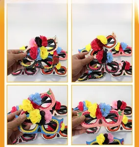 Detailed views of four vibrant Day of the Dead masks with floral and glitter skull designs