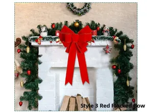 Detail of red flocked Christmas bow with gold edges on a decorated festive fireplace