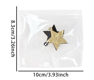 Détail des boucles d'oreilles étoiles scintillantes noires et dorées avec mesures