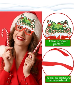 Detail of red Merry Christmas glasses featuring elastic legs and clear festive patterns