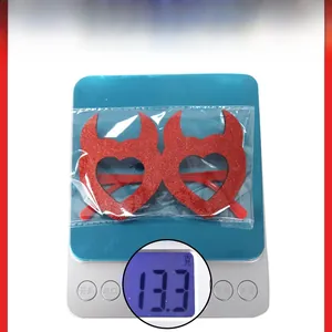 Red glitter devil heart glasses for party favors weighing 13.3 grams on scale