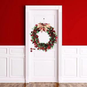 Christmas snowman wreath with red berries and golden Merry Christmas bow on white door