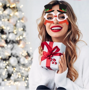 Detail of Christmas snowman party glasses with top hat and scarf on a model