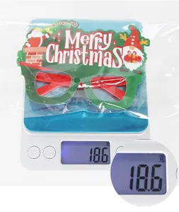 Close-up of festive Christmas party glasses on a scale weighing 18.6g for shipping