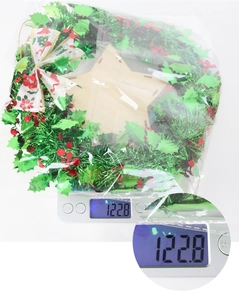 Detailed view of the 122.8g weight measurement for the festive Christmas berry wreath