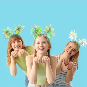 Close-up of Easter headbands featuring bunny ears and colorful egg ornaments on models