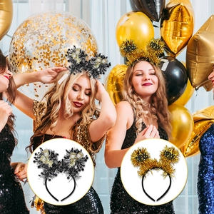 Detail of Happy New Year headbands with gold glitter tinsel and black sequin stars