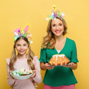 Close-up of Easter bunny ears and chick headbands worn by models in festive setting