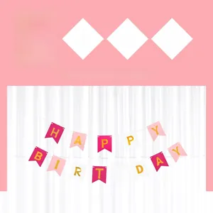 Detailed view of pink and white swallowtail Happy Birthday banner with gold letters