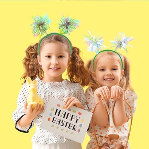 Kids Easter headband set with colorful tinsel pom-poms on green band for holiday dress-up