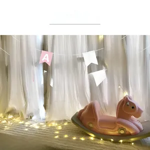 Detail of red and pink Happy Birthday bunting banner with gold foil letters for parties