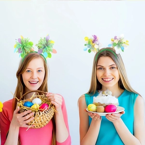 Detail of festive Easter headbands with colorful eggs and tinsel on young girls