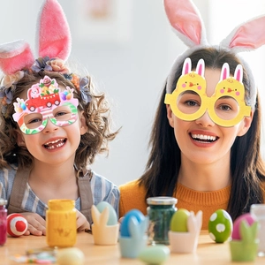 Close-up of Easter paper glasses featuring bunny and chick designs in a festive scene