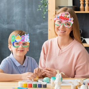 Kids and adults wearing Easter cartoon paper glasses with chicks and eggs for party photos