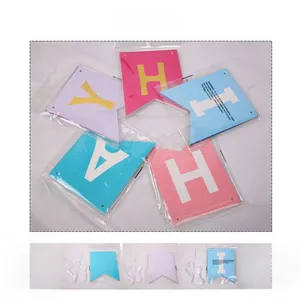 Macro shot of colorful Happy Birthday letter banner flags packed in clear OPP plastic bags
