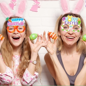 Kids and adults wearing Easter carrot and bunny themed party glasses for festive photo props