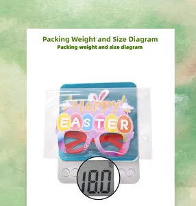 Detailed view of packed Easter bunny glasses on a scale showing 18.0g weight