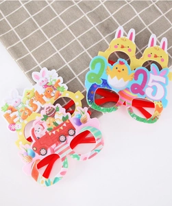 Detailed view of colorful Easter party glasses with rabbit, chick, and egg designs
